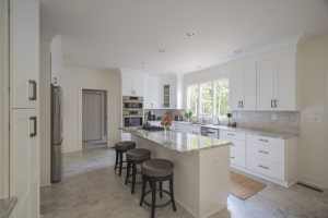 My Kitchen and Bath's Kitchen Remodeling Project Photos in Wolf Trap, VA - White Kitchen Cabinets with Fantasy Brown Granite Countertop