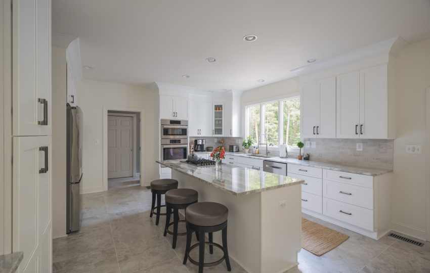 My Kitchen and Bath's Kitchen Remodeling Project Photos in Wolf Trap, VA - White Kitchen Cabinets with Fantasy Brown Granite Countertop