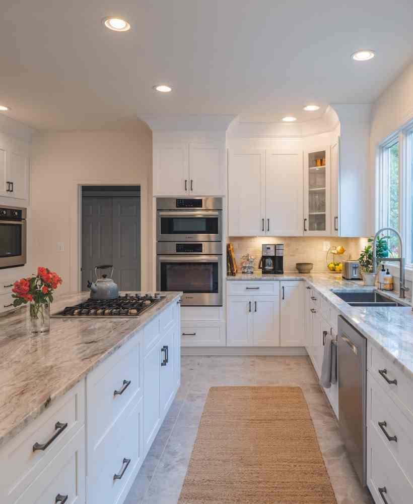 My Kitchen and Bath's Kitchen Remodeling Project Photos in Wolf Trap, VA - White Kitchen Cabinets with Fantasy Brown Granite Countertop