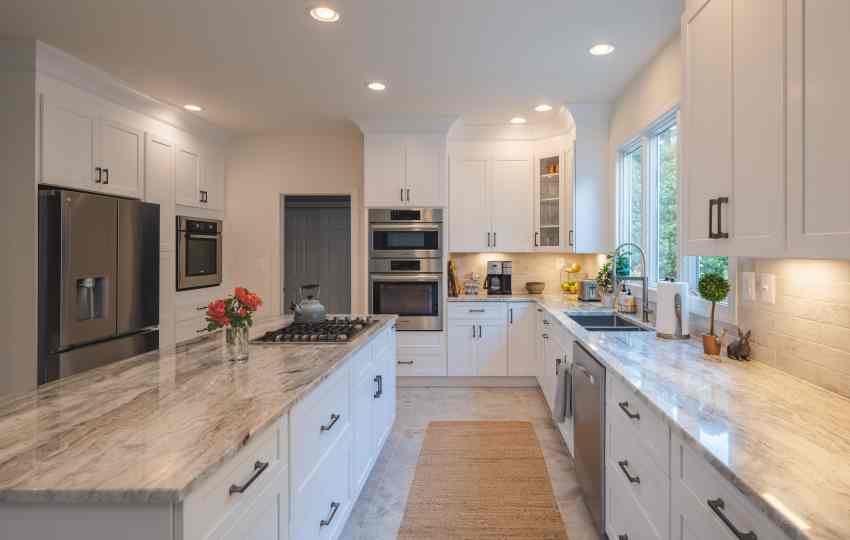My Kitchen and Bath's Kitchen Remodeling Project Photos in Wolf Trap, VA - White Kitchen Cabinets with Fantasy Brown Granite Countertop