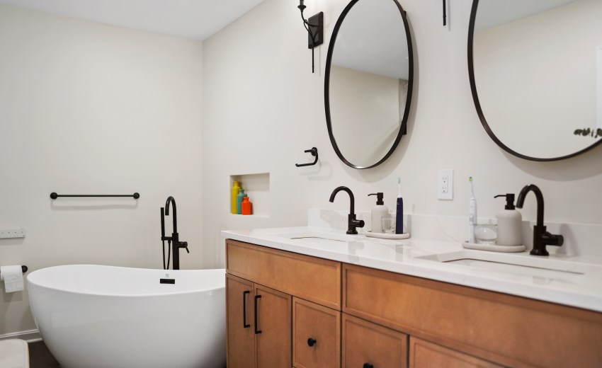 a bathroom with a tub and sink