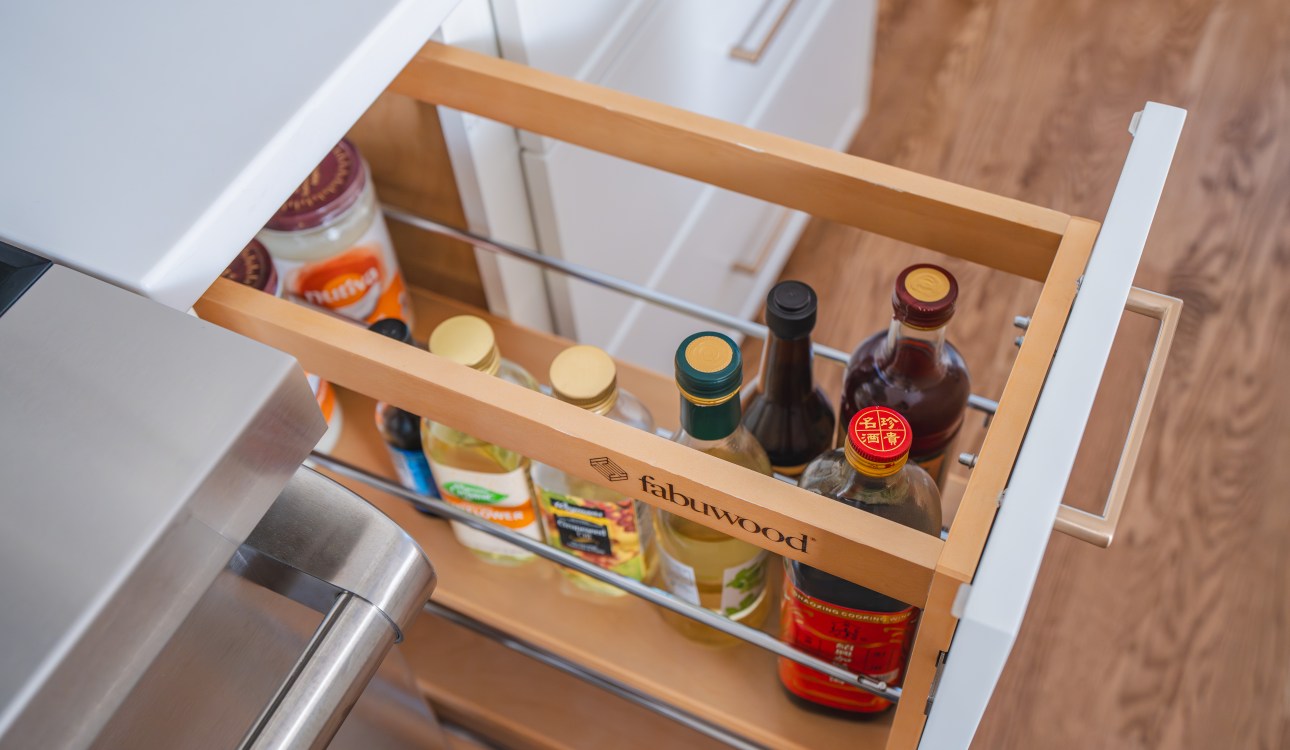 a drawer with bottles in it - modern and sleek kitchen in oakton va